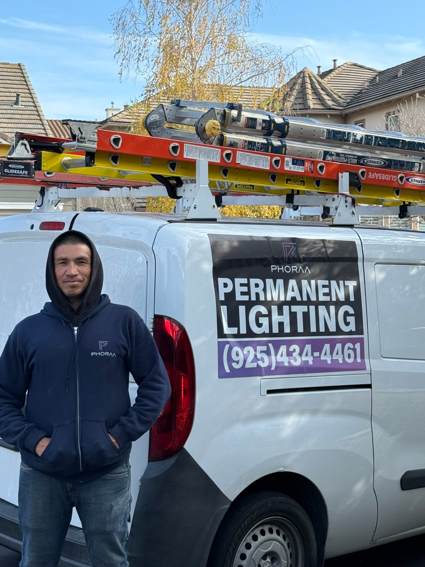 Victor, project manager at Phoraa Lighting, beside the company van